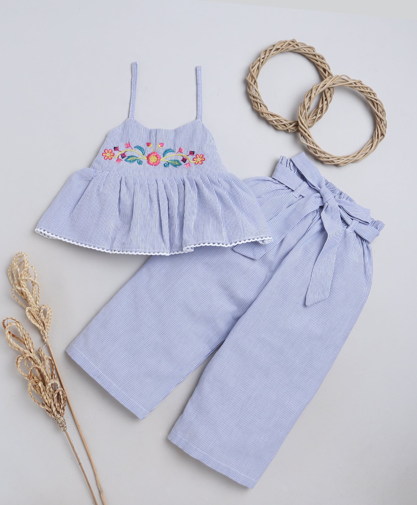 Knitting Doodles Premium Cotton Girls' Stripes Coordset with paper bag pants and crop top with Smart Floral embroidery on yolk- Blue and white